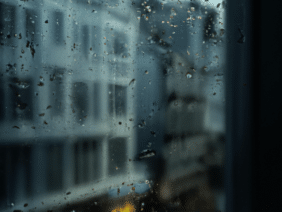 rain falling on window and windowsill