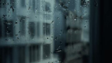 rain falling on window and windowsill