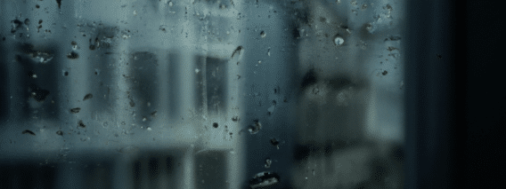 rain falling on window and windowsill